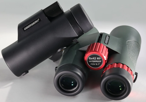 An Oberwerk 8x32 Sport HD II monocular on top of an Oberwerk 8x42 Sport ED binocular