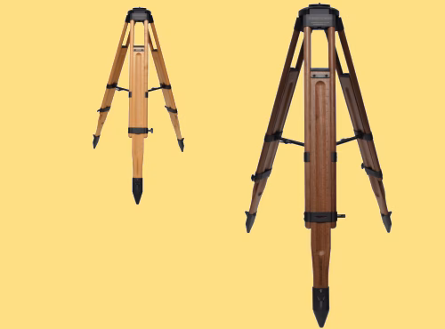 A walnut Oberwerk TR3 tripod in the foreground and a maple Obewerk TR3 tripod in the background